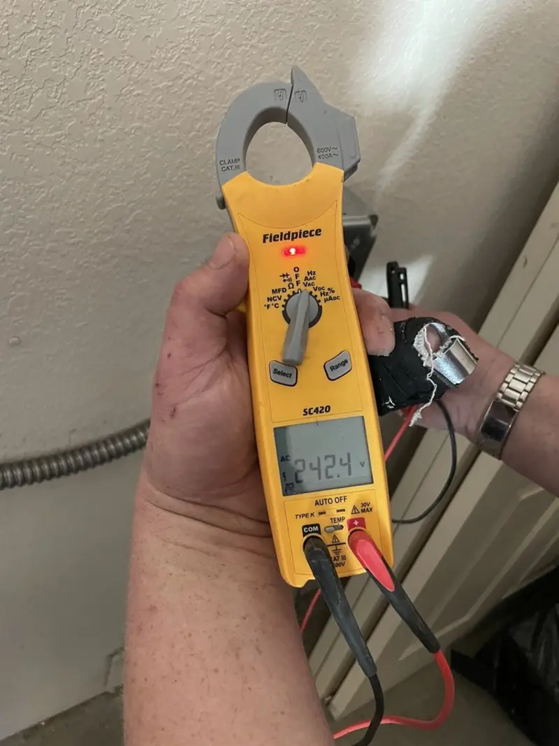 Voltage testing with clamp meter during Electrical Installation Services in London